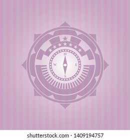 compass icon inside pink emblem. Retro