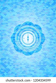 compass icon inside realistic light blue emblem. Mosaic background