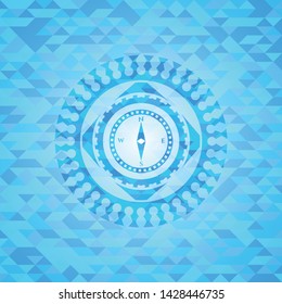 compass icon inside realistic sky blue emblem. Mosaic background