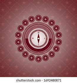 icono de brújula dentro del emblema rojo