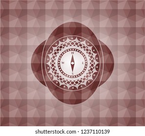 compass icon inside red seamless emblem with geometric pattern.