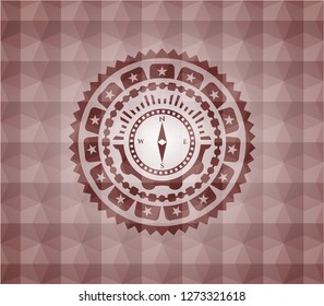 compass icon inside red seamless badge with geometric pattern background.