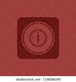 compass icon inside retro red emblem