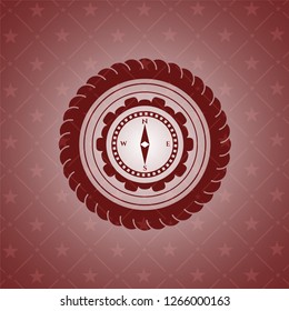 compass icon inside retro red emblem