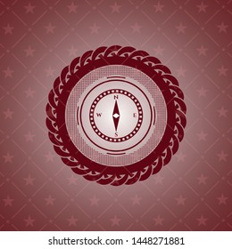 compass icon inside retro red emblem