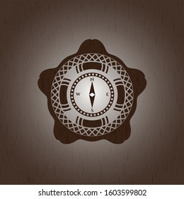 compass icon inside retro wooden emblem