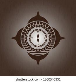compass icon inside retro wooden emblem