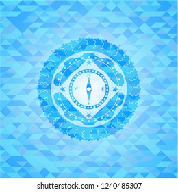 compass icon inside sky blue emblem. Mosaic background