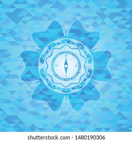 compass icon inside sky blue emblem with mosaic ecological style background