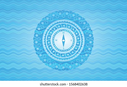 compass icon inside water representation emblem background.
