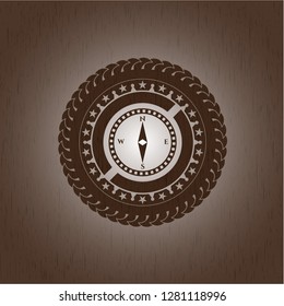 compass icon inside wooden signboards