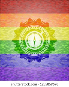 compass icon on mosaic background with the colors of the LGBT flag