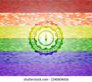 compass icon on mosaic background with the colors of the LGBT flag
