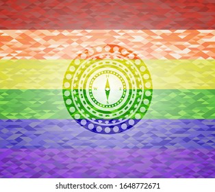 compass icon on mosaic background with the colors of the LGBT flag