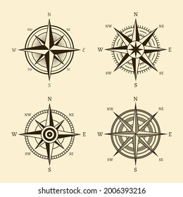 Compass icons. Hand drawn wind rose vintage style. West east and south north navigation, travel and adventure symbol, retro discovery element. Geography maps design vector isolated set