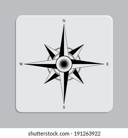 compass rose on a grey flat button