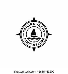 compass with sailing boat logo design