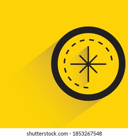 compass with shadow on yellow background