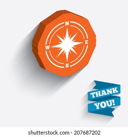 Compass sign icon. Windrose navigation symbol. White icon on orange 3D piece of wall. Carved in stone with long flat shadow. Vector