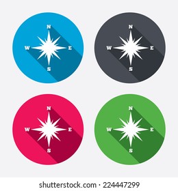 Compass sign icon. Windrose navigation symbol. Circle buttons with long shadow. 4 icons set. Vector