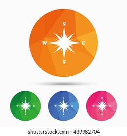Compass sign icon. Windrose navigation symbol. Triangular low poly button with flat icon. Vector
