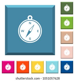 Compass white icons on edged square buttons in various trendy colors