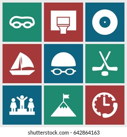 Competition icons set. set of 9 competition filled icons such as ranking, sailboat, basketball basket, hockey, swimming hat and glasses, stopwatch, flag on mountain, target