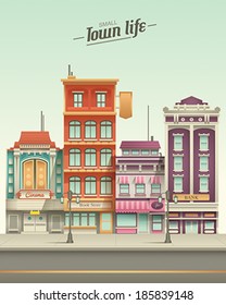 Complex vector illustration depicting a colorful street in side view which includes 4 buildings and lamps.  The colors are meant to resemble a retro technicolor movie scheme.