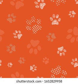 Complex vector illustration print in coral and cream. Seamless pattern with cats and dogs paw prints isolated from background. Perfect for gifts, wallpaper, fabric and scrapbooking.