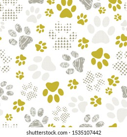 Complex vector illustration print in yellow, lime and white. Seamless pattern with cats and dogs paw prints on white background. Perfect for gifts, wallpaper, fabric and scrapbooking.