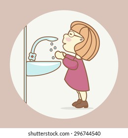 Compliance with the rules of sanitation and hygiene: a girl washes her hands in the bathroom