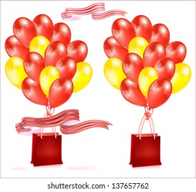 Composition with balloons and red and yellow gift bag with ribbon.