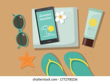 Composition with beach accessories. Sunglasses, towel, sun block, flip-flops and phone on sandy beach