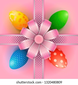 Composition with Easter eggs and a bow with a decorative ribbon cross hair on a pink background. Beautiful greeting card or banner for Easter.