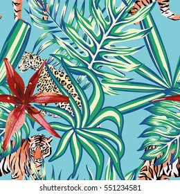 Composition of tropical leaf beautiful flower lily wild animals leopard and tiger. Seamless wallpaper pattern on a blue background