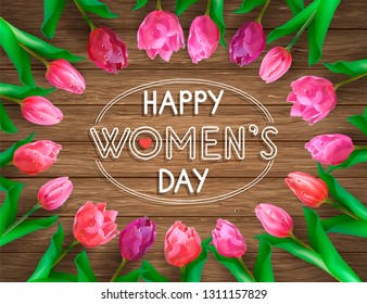 A composition with tulips laid out a wreath and a large inscription on a wooden background. Beautiful greeting card or banner for women's day.