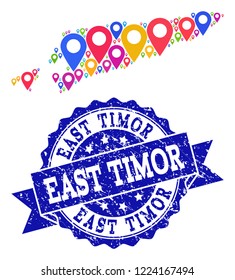 Compositions of colorful map of East Timor and grunge stamp seal. Mosaic vector map of East Timor is formed with colorful site pointers. Flat design elements for touristic applications.