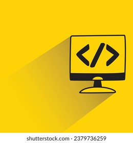 computer and coding with shadow on yellow background