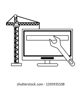 computer with construction crane and wrench black and white