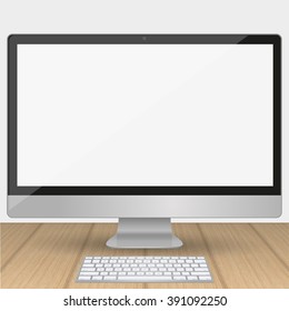 Computer  display with blank white screen isolated on a wooden table in the interior