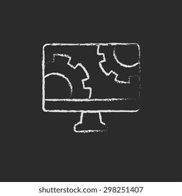 Computer in gear hand drawn in chalk on a blackboard vector white icon on a black background