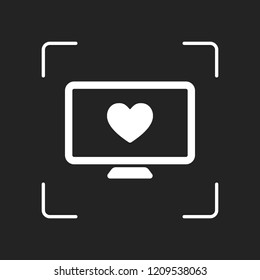 computer and heard. simple icon. White object in camera autofocus on dark background