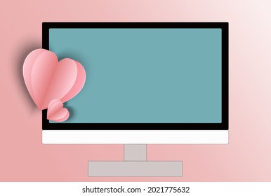 computer and heart on pink background