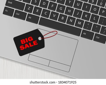 Computer keyboard and black tag with the inscription 'Big sale'. Online shopping concept. Vector illustration
