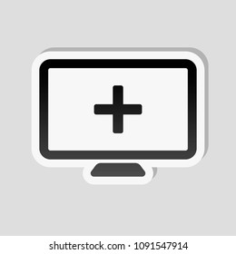 computer and medical cross, medical site. simple icon. Sticker style with white border and simple shadow on gray background