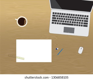 Computer notebook with note paper, stationary and a cup of coffee on wooden desk