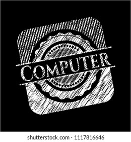 Computer on chalkboard