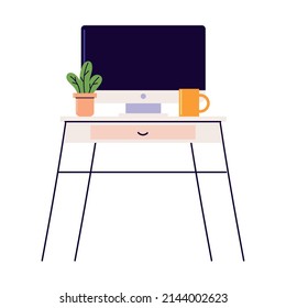 computer on table with cup and plant