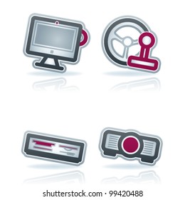 Computer parts and accessories, pictured here from left to right: All-in-one computer, Game Steering wheel, Multimedia card reader, Projector.