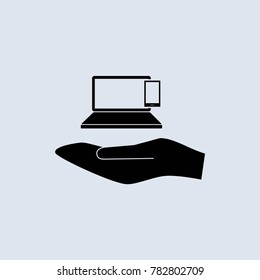 computer and phone on hand